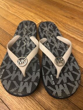 Woman’s 11 Michael Kors Black MK Logo Flip Flops with Cream Straps
